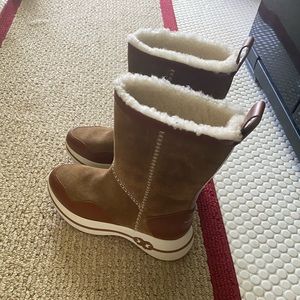 Never worn Tory Burch shearling suede boots.  9.5